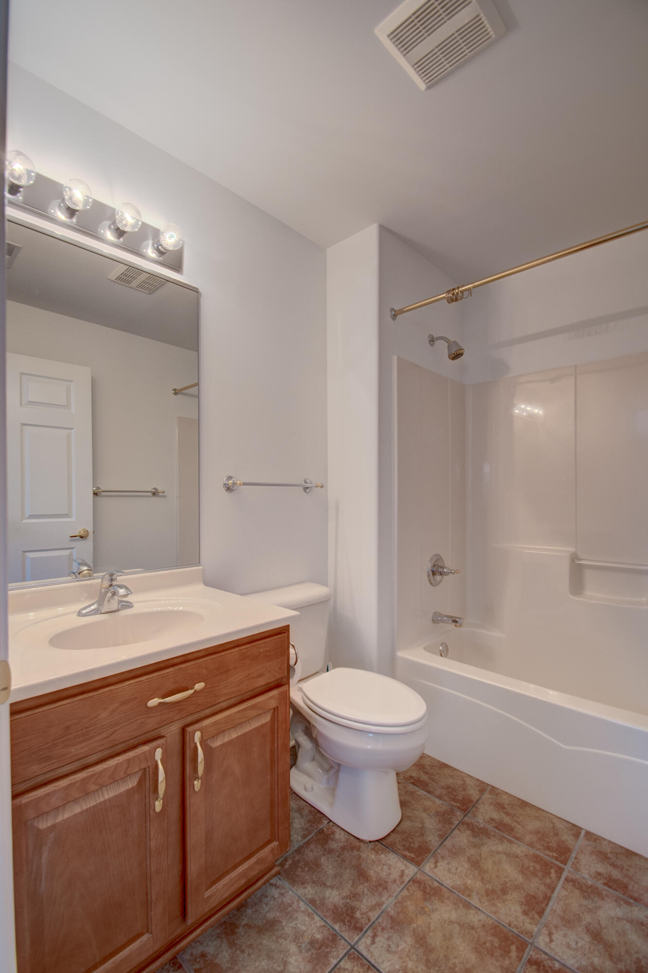 10677 Keystone Lane Crown Point, IN 46307 - Photo 19 of 33 a spacious bathroom with a sink a toilet a mirror and shower