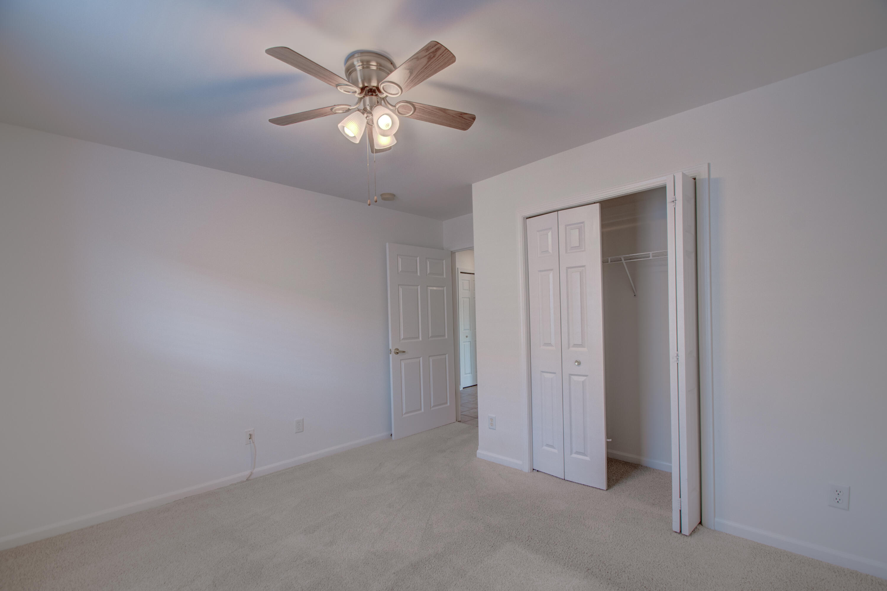 10677 Keystone Lane Crown Point, IN 46307 - Photo 21 of 33 an empty room with chandelier fan