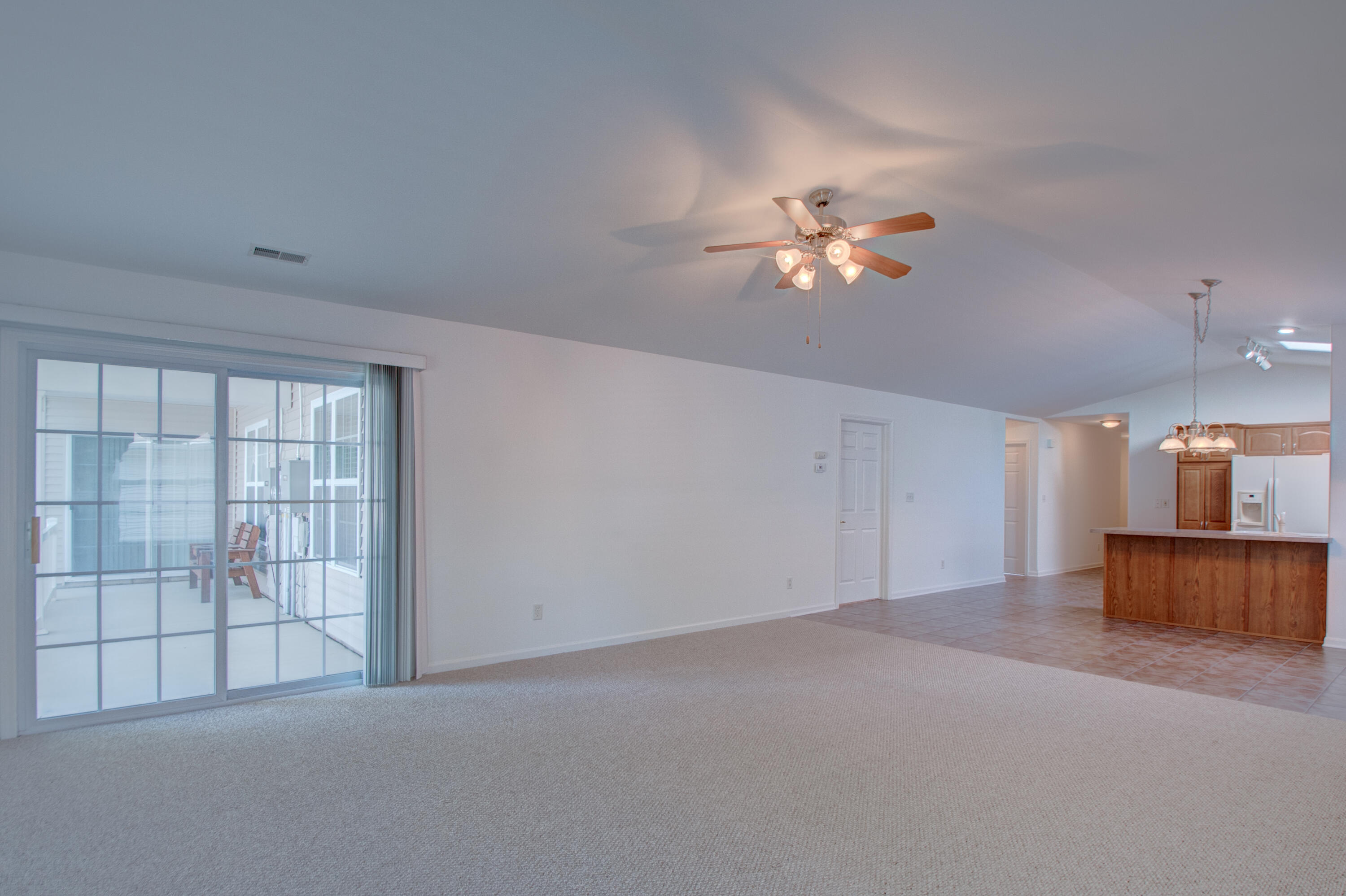10677 Keystone Lane Crown Point, IN 46307 - Photo 6 of 33 a view of empty room with a ceiling fan and window