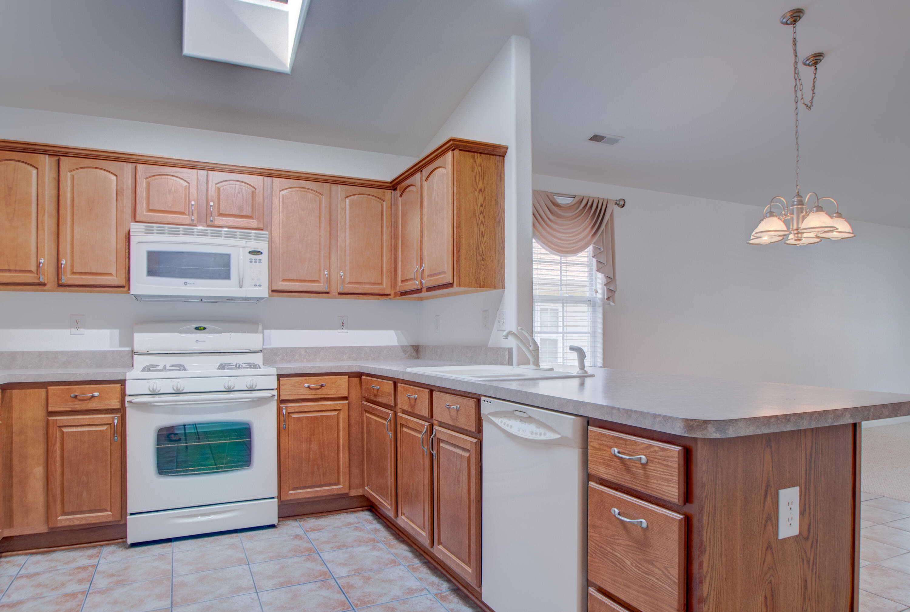 10677 Keystone Lane Crown Point, IN 46307 - Photo 10 of 33 a kitchen with a sink stove and cabinets