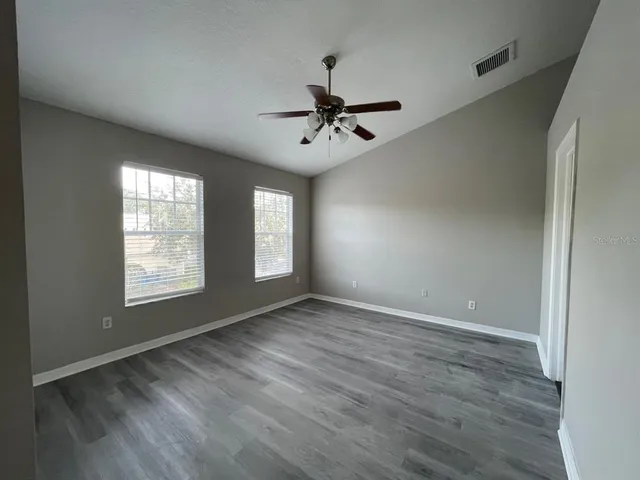 a view of front door with wooden floor