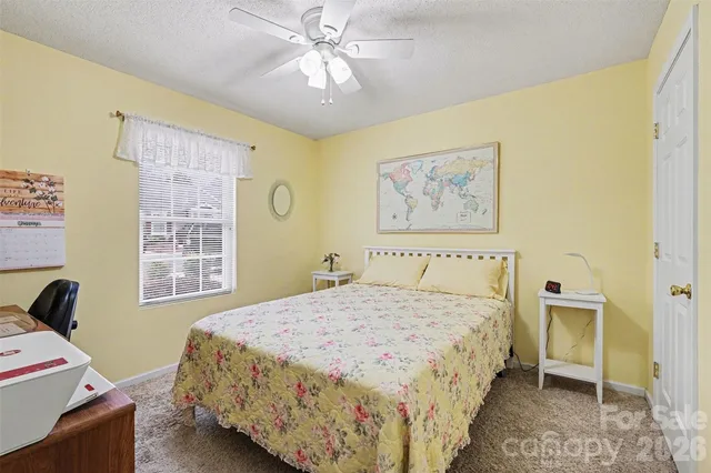 a dining room with wooden floor a chandelier a wooden table and chairs