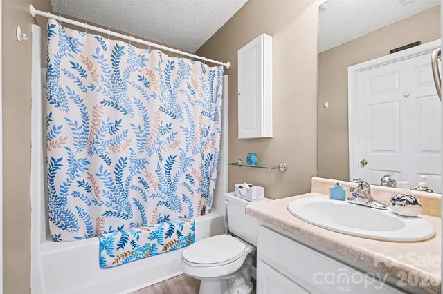 a view of a livingroom with furniture and window