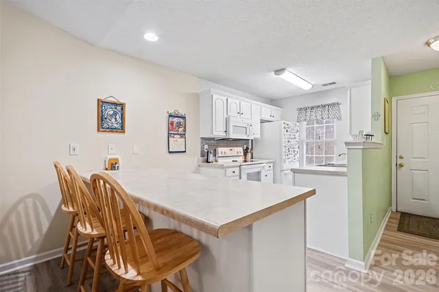 a dining room with furniture wooden floor and a livingroom