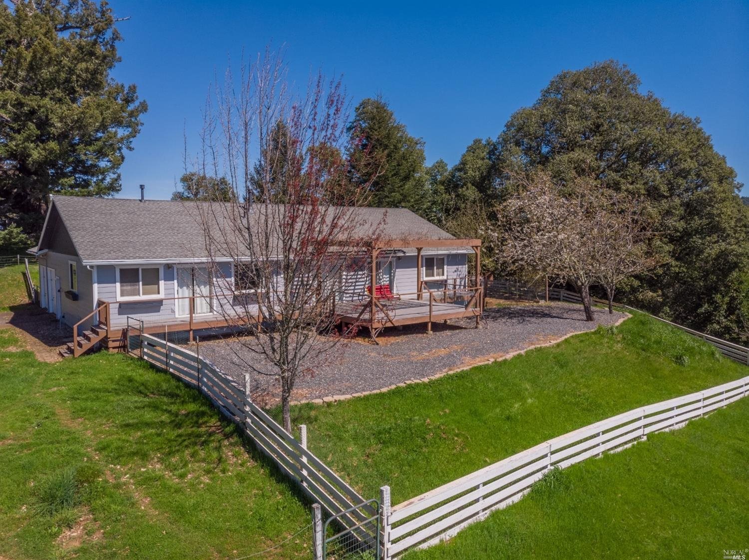 5670 High Point Road Willits, CA 95490 - Photo 1 of 1 Freshly painted surrounded by greenery.