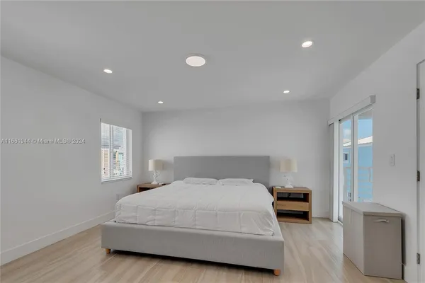 a bedroom with a bed and a couch