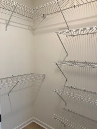 a view of a room with racks on the wall
