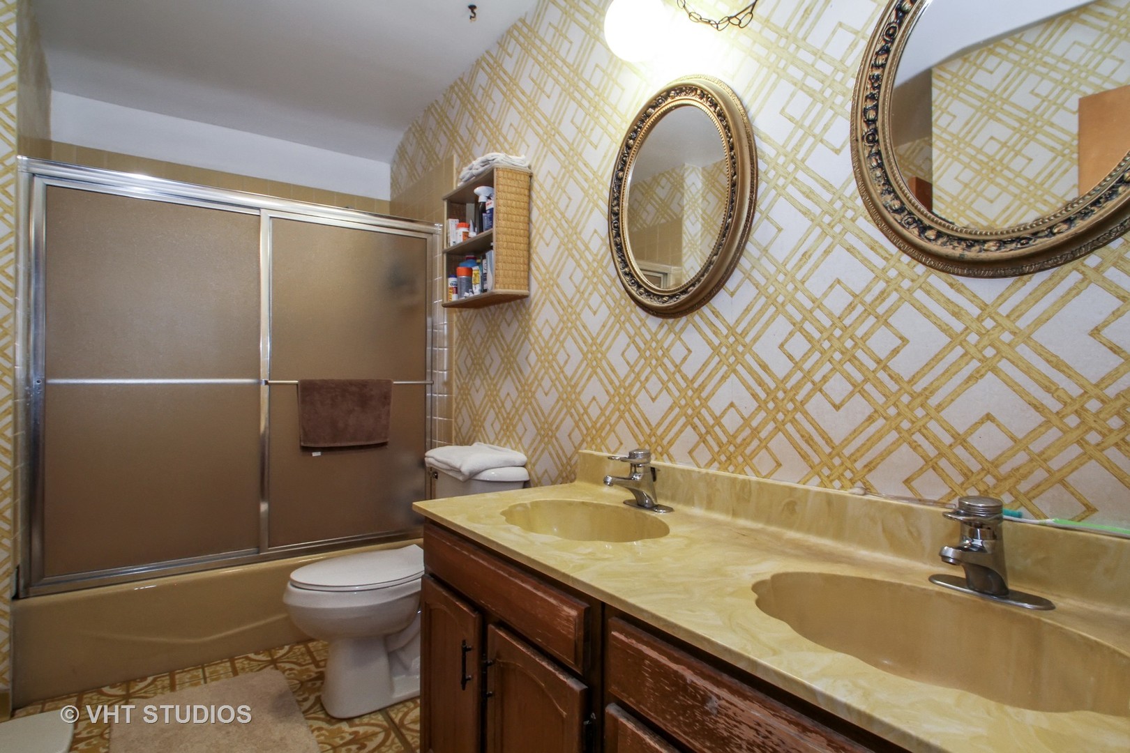 14008 Davis Road Woodstock, IL 60098 - Photo 11 of 32 a bathroom with a sink a toilet and a mirror