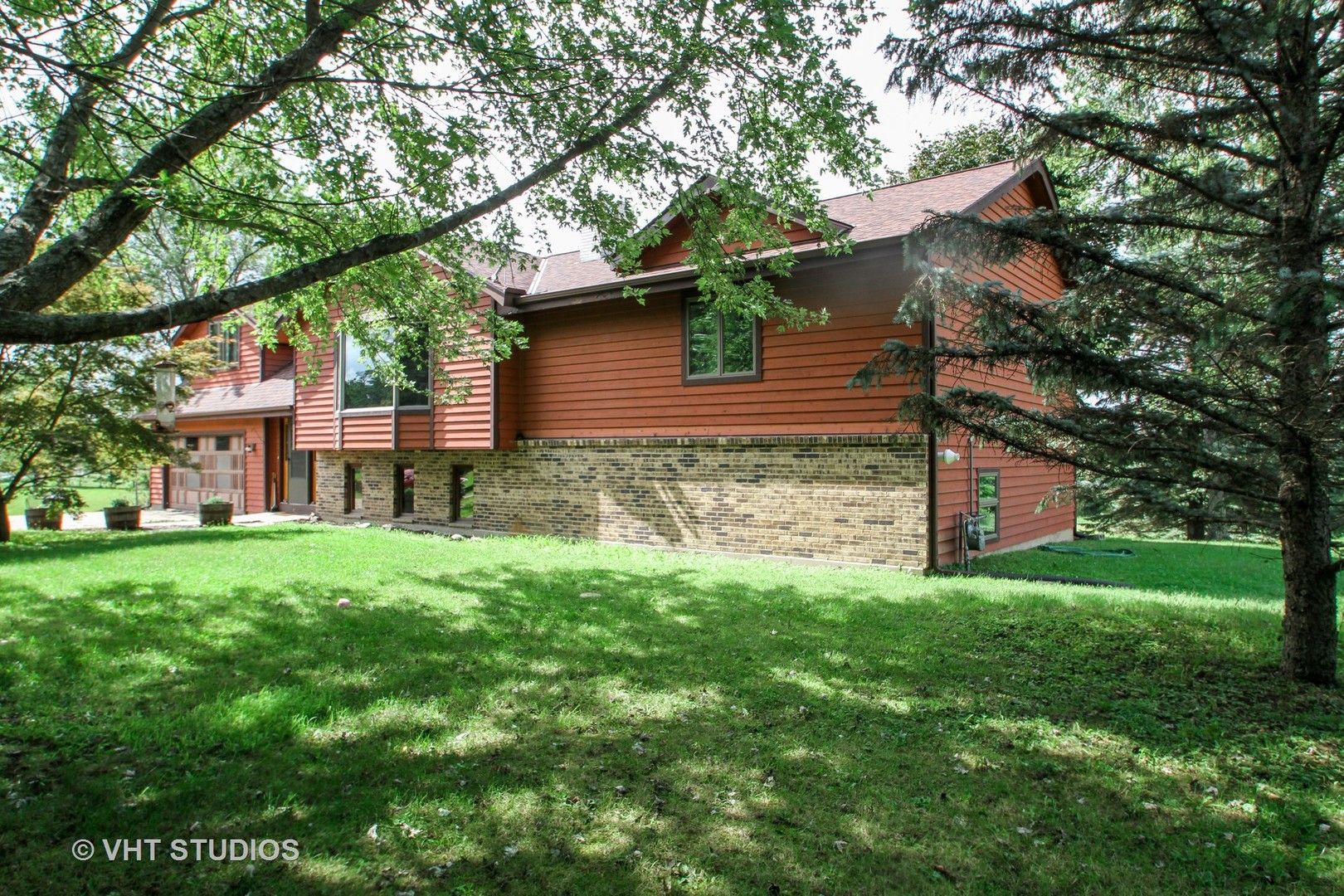14008 Davis Road Woodstock, IL 60098 - Photo 25 of 32 a view of a house with a yard
