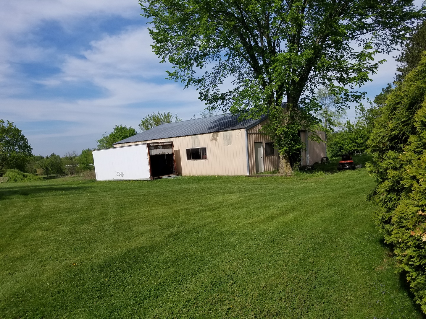 14008 Davis Road Woodstock, IL 60098 - Photo 31 of 32 a view of a backyard with large trees