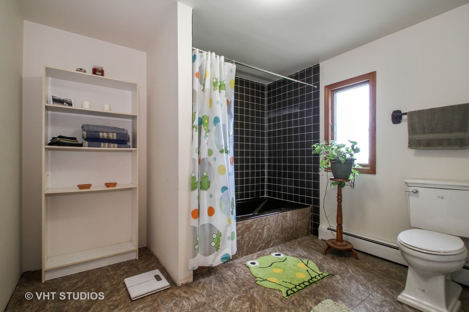 14008 Davis Road Woodstock, IL 60098 - Photo 7 of 32 a bathroom with a toilet a sink and shower