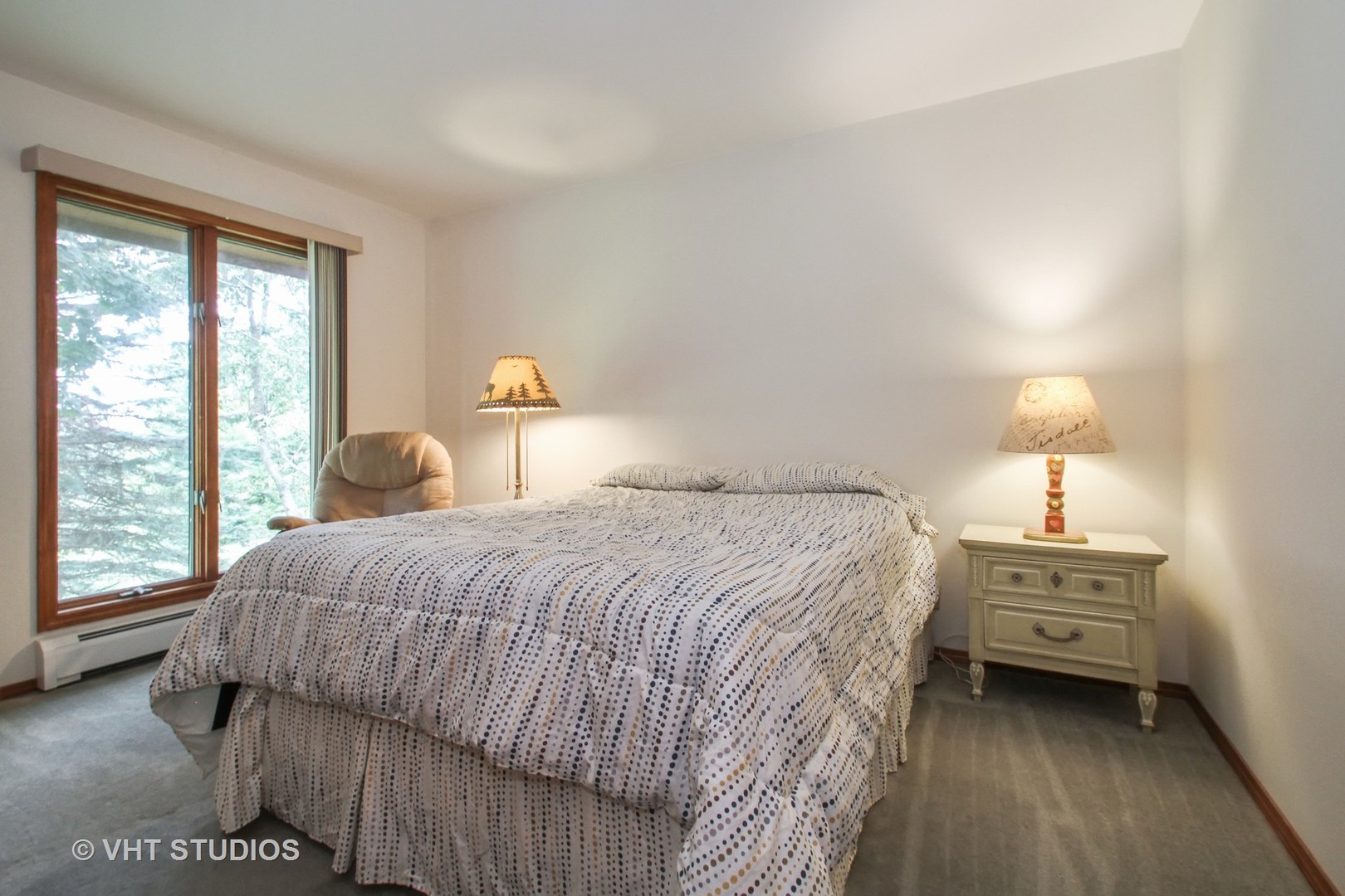 14008 Davis Road Woodstock, IL 60098 - Photo 8 of 32 a bedroom with a bed and a window