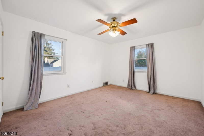 610 Lee Avenue Beverly, NJ 08010 - Photo 15 of 21 an empty room with closet and fan