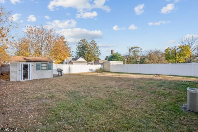 a view of a backyard of the house