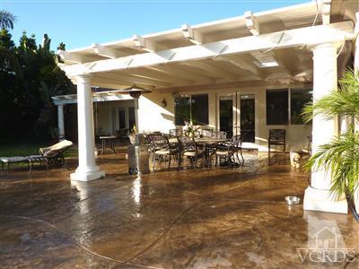 839 Rancho Road Thousand Oaks, CA 91362 - Photo 22 of 29 a view of a patio with table and chairs potted plants and palm tree