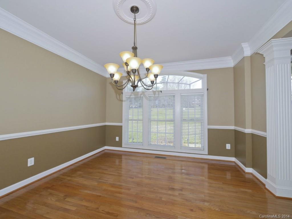 713 Reverdy Court Fort Mill, SC 29708 - Photo 3 of 19 a view of a room with wooden floor and chandelier