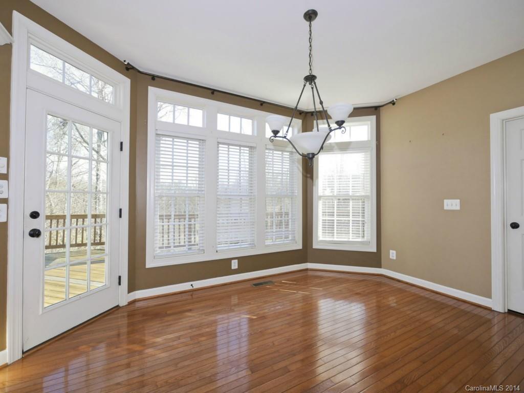 713 Reverdy Court Fort Mill, SC 29708 - Photo 7 of 19 a view of an empty room with wooden floor and a window