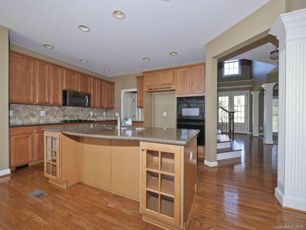 713 Reverdy Court Fort Mill, SC 29708 - Photo 9 of 19 a kitchen with stainless steel appliances granite countertop a stove and cabinets
