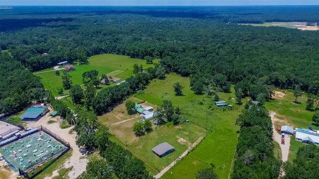 an aerial view of residential house with outdoor space