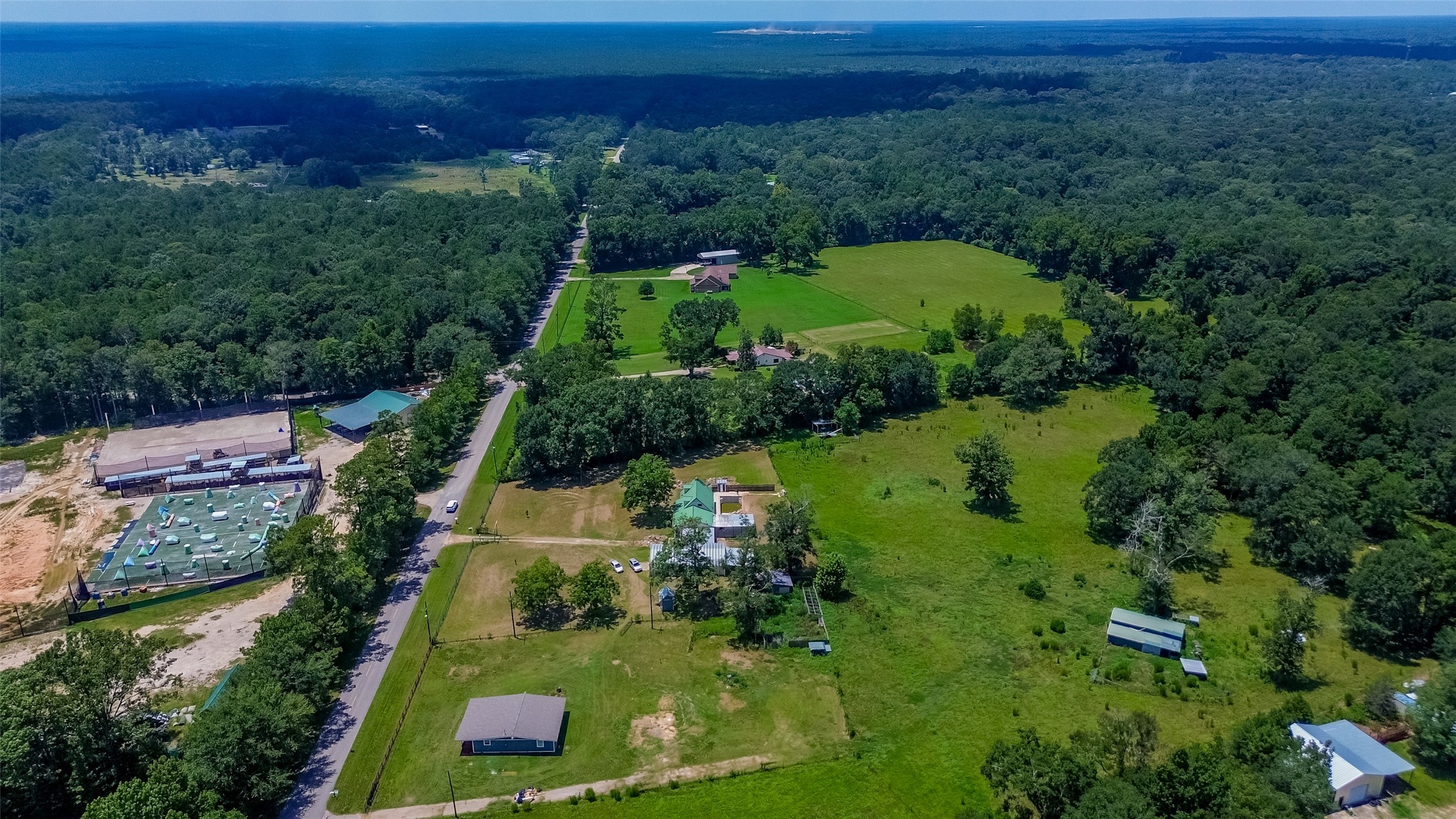 22573 Morgan Cemetery Road Cleveland, TX 77328 - Photo 13 of 16 an aerial view of residential house with outdoor space