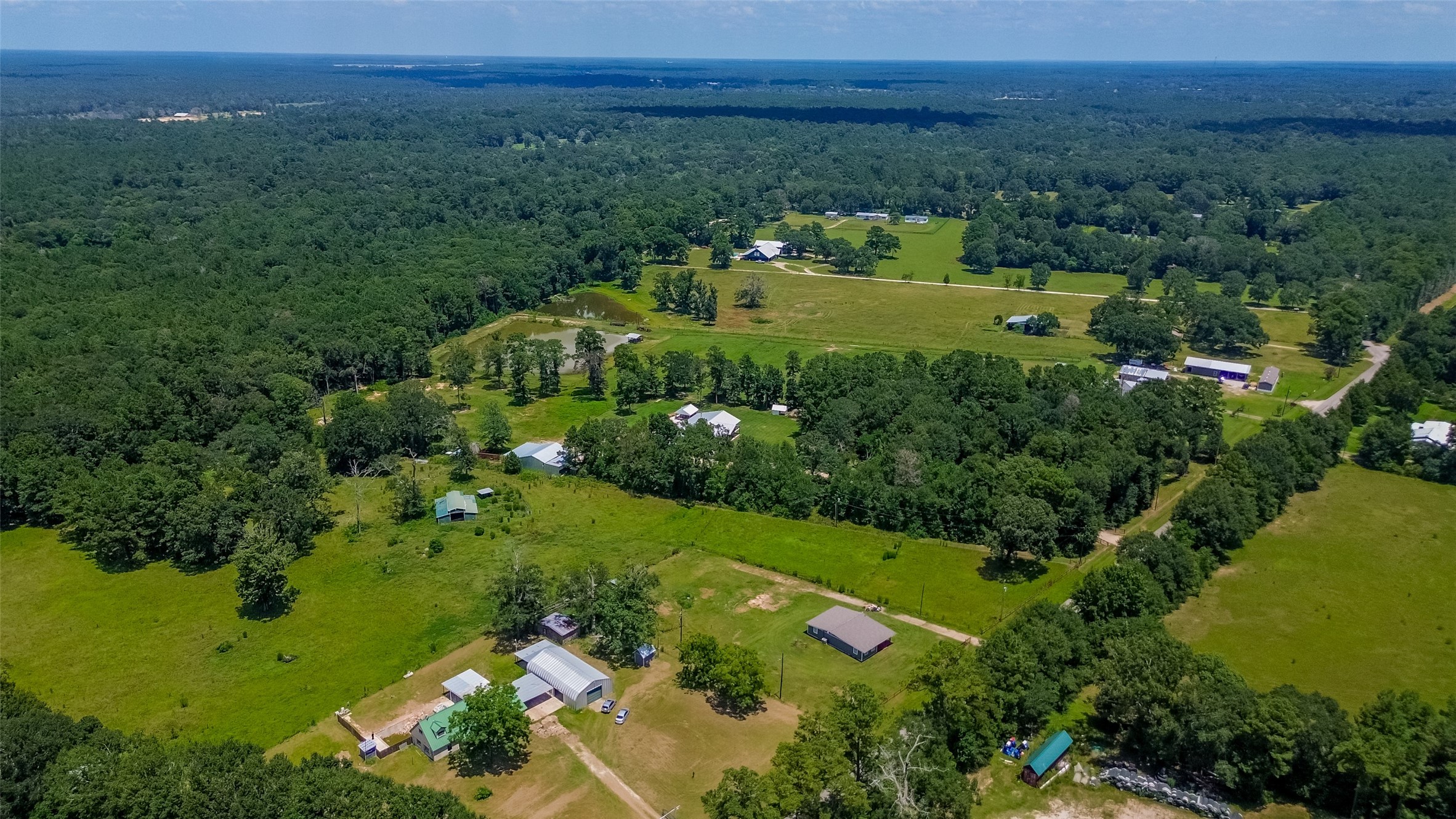 22573 Morgan Cemetery Road Cleveland, TX 77328 - Photo 16 of 16 an aerial view of a residential houses with outdoor space and trees all around