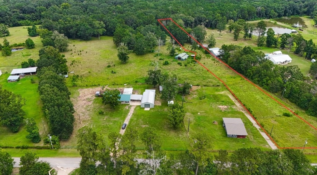 22573 Morgan Cemetery Road Cleveland, TX 77328 - Photo 4 of 16 an aerial view of residential houses with outdoor space and trees all around