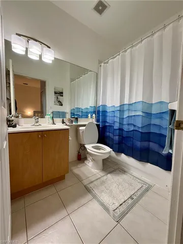 a kitchen with a sink a stove cabinets and counter space