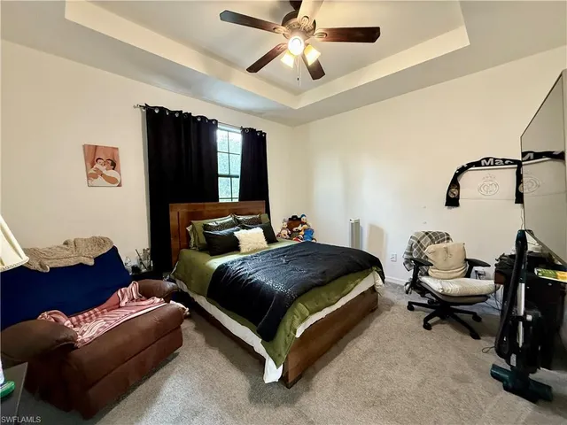 a bedroom with bed and a window