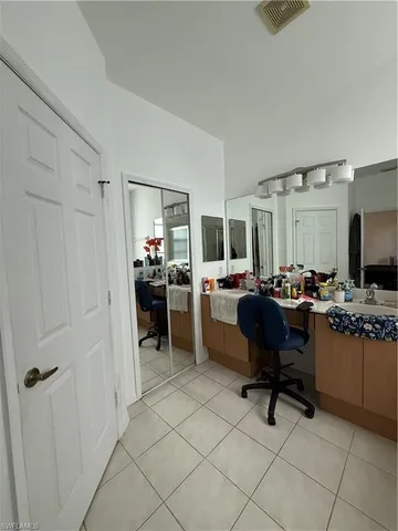 a view of kitchen with sink refrigerator and outdoor living room