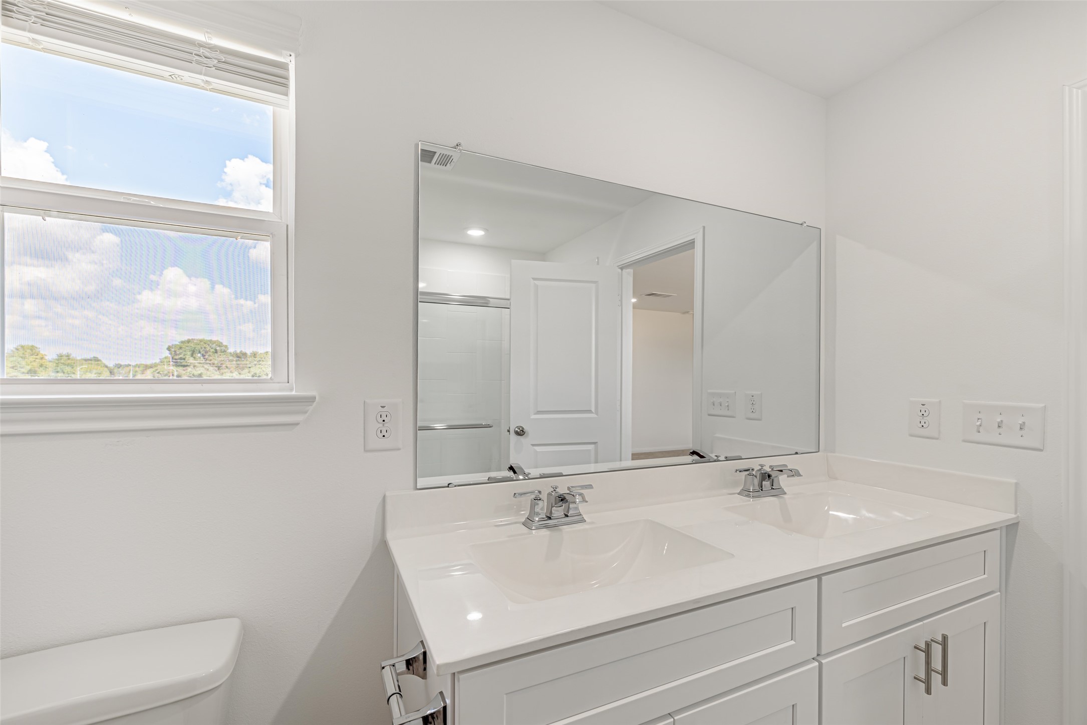 23422 Wagon Cart Road Hockley, TX 77447 - Photo 15 of 28 a bathroom with a sink a toilet and a mirror