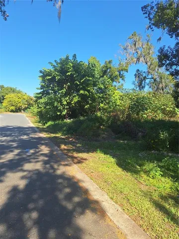 a view of a lake with a yard
