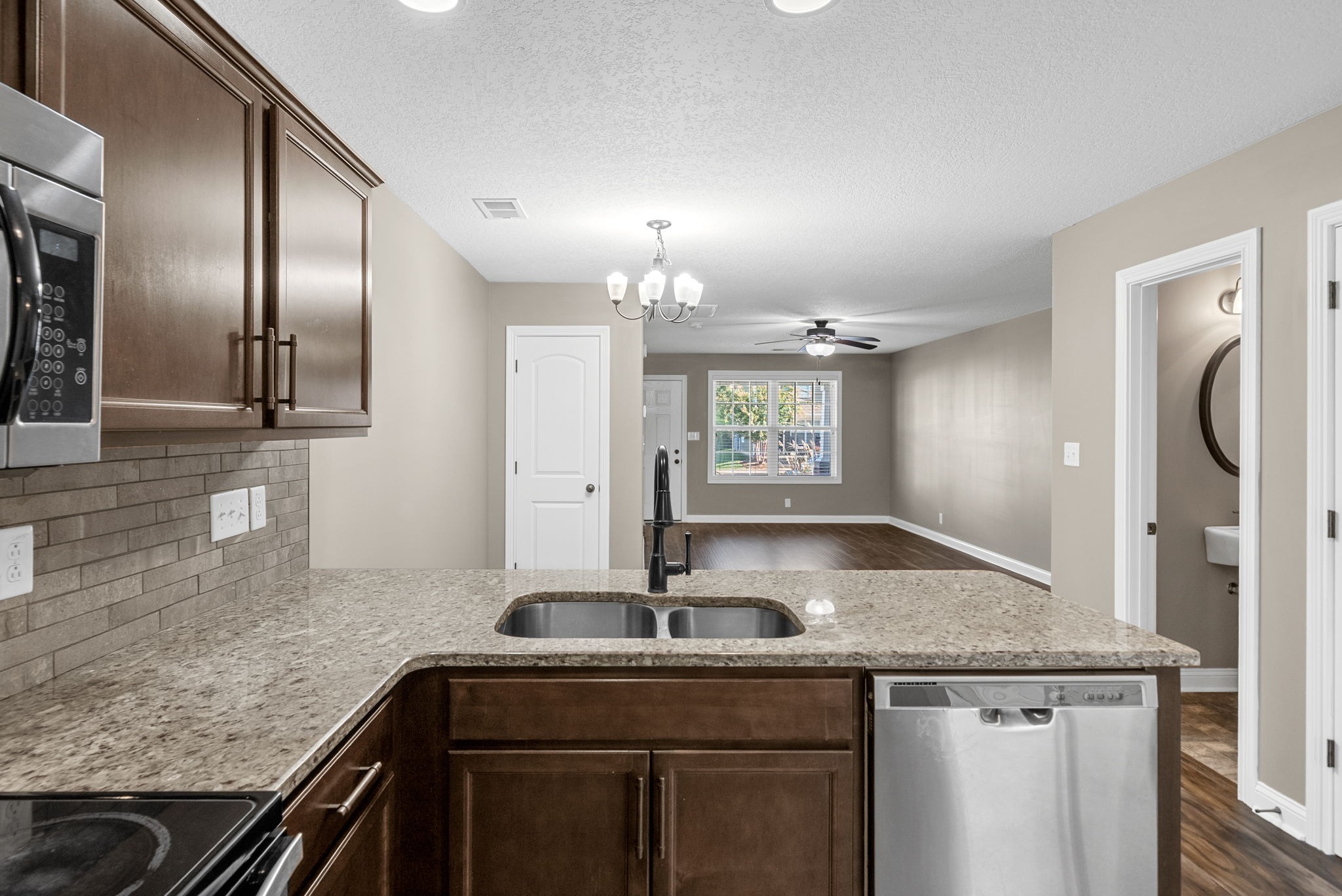 352 Sam Houston Circle Clarksville, TN 37040 - Photo 15 of 29 a kitchen with granite countertop a sink and cabinets