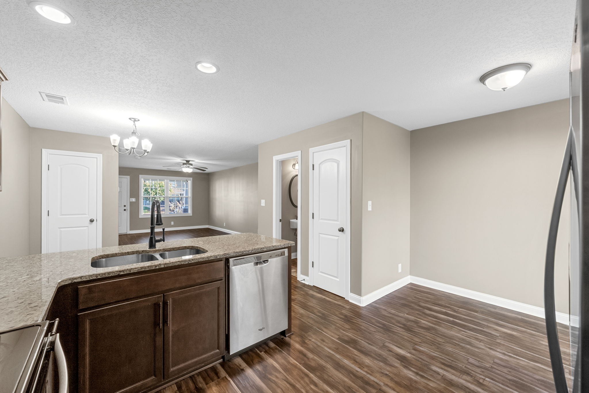 352 Sam Houston Circle Clarksville, TN 37040 - Photo 16 of 29 a kitchen with sink cabinets and wooden floor