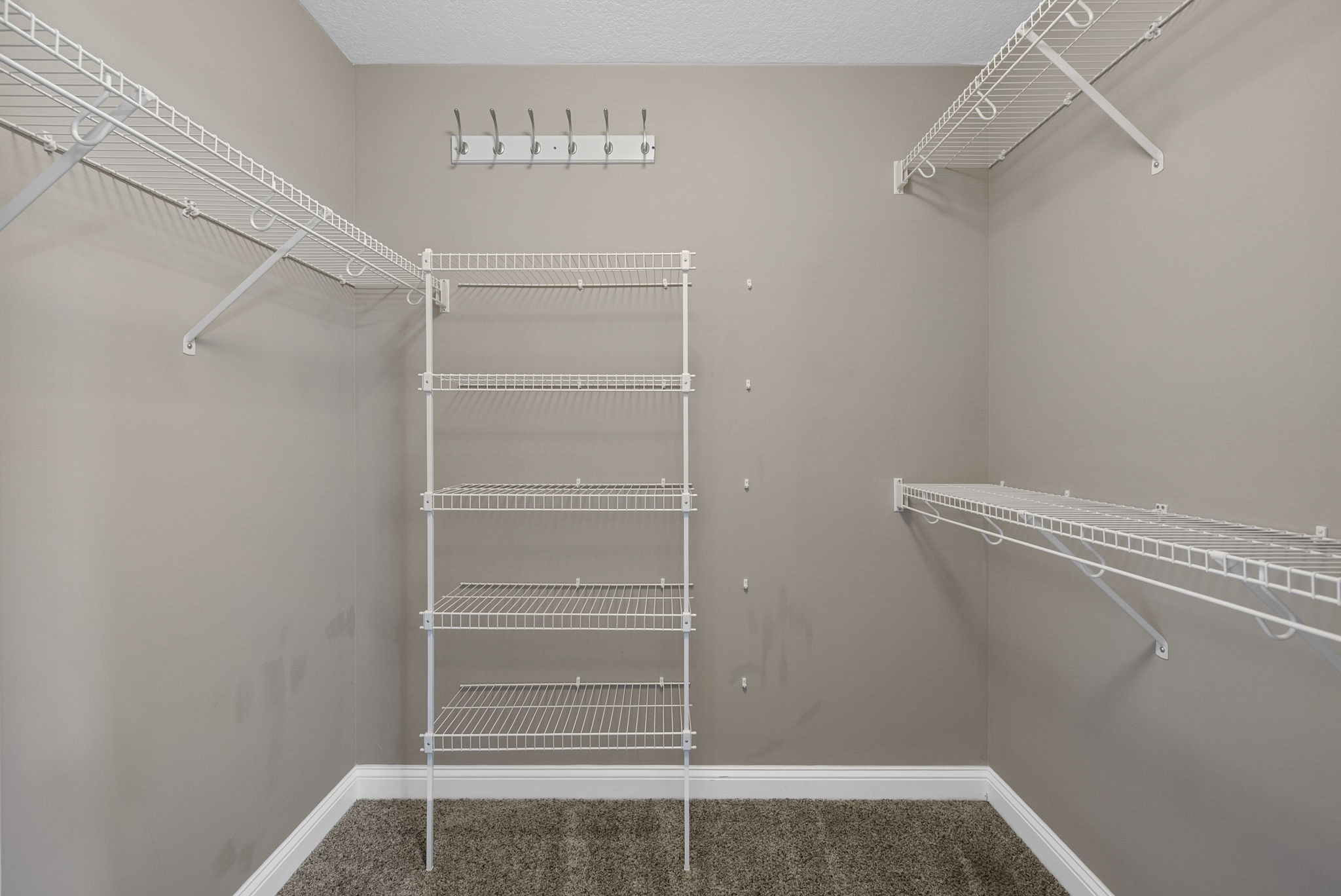 352 Sam Houston Circle Clarksville, TN 37040 - Photo 21 of 29 a view of walk in closet with empty racks