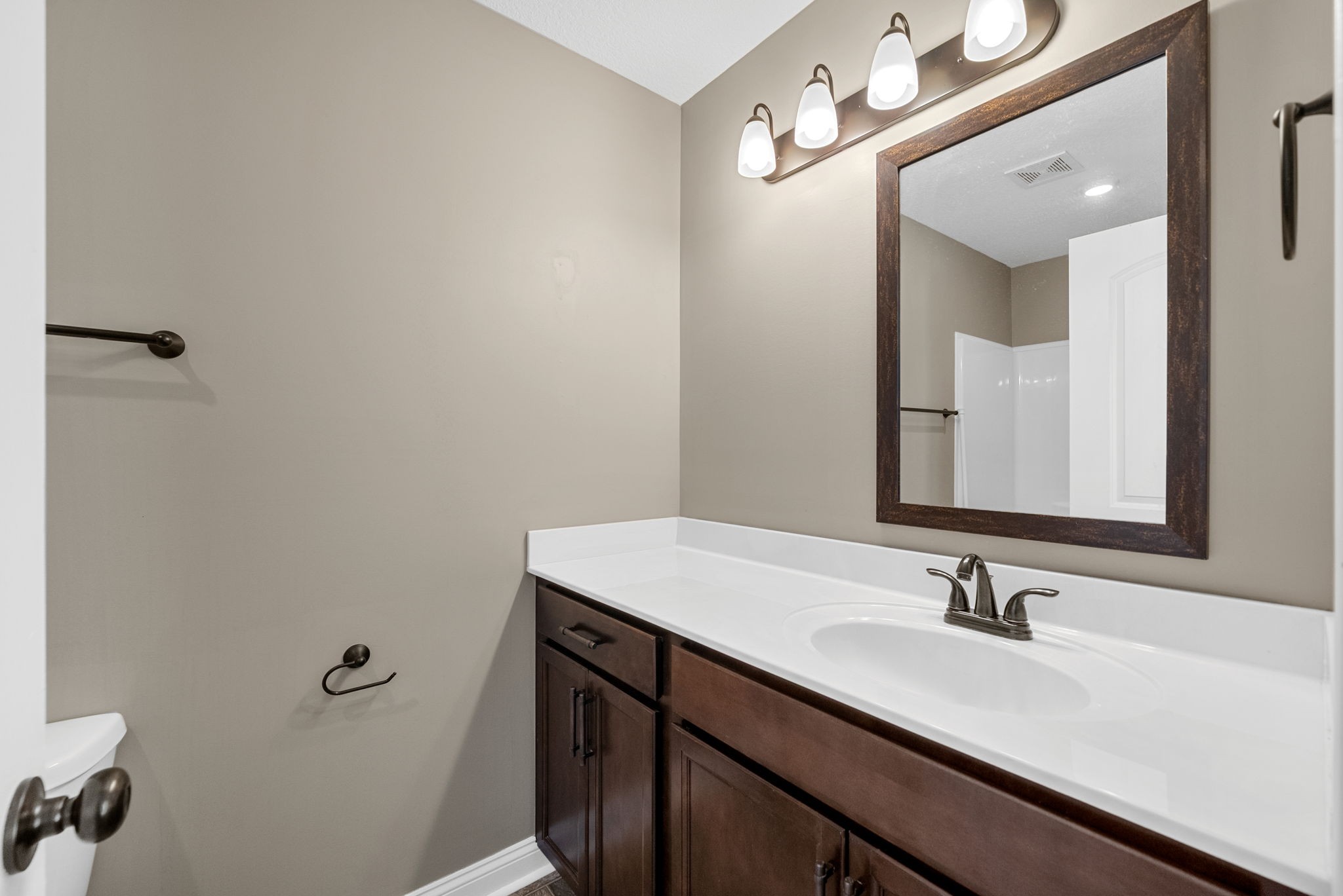 352 Sam Houston Circle Clarksville, TN 37040 - Photo 22 of 29 a bathroom with a sink vanity and a mirror