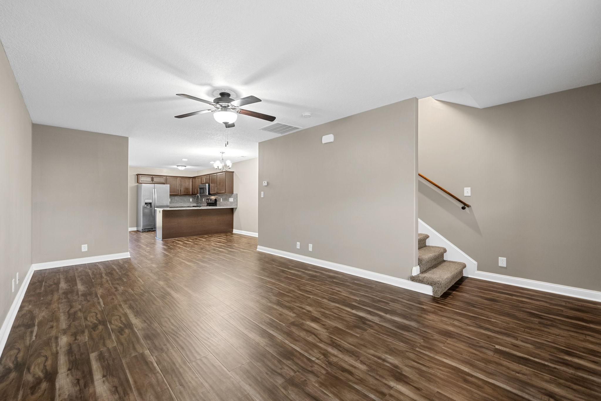 352 Sam Houston Circle Clarksville, TN 37040 - Photo 6 of 29 a view of livingroom with hardwood floor and a ceiling fan