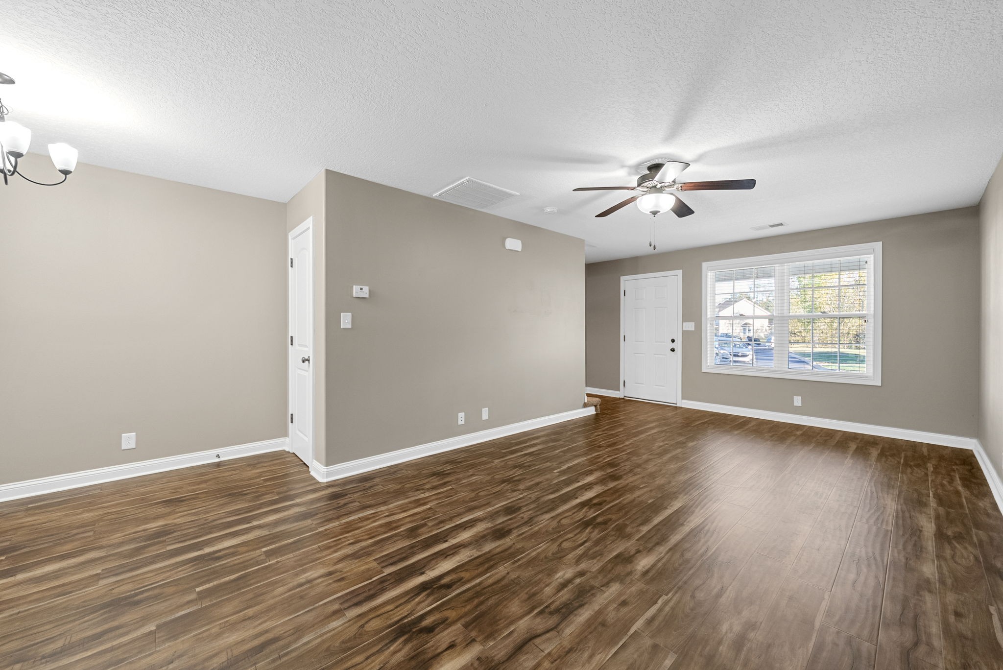 352 Sam Houston Circle Clarksville, TN 37040 - Photo 7 of 29 an empty room with window and wooden floor