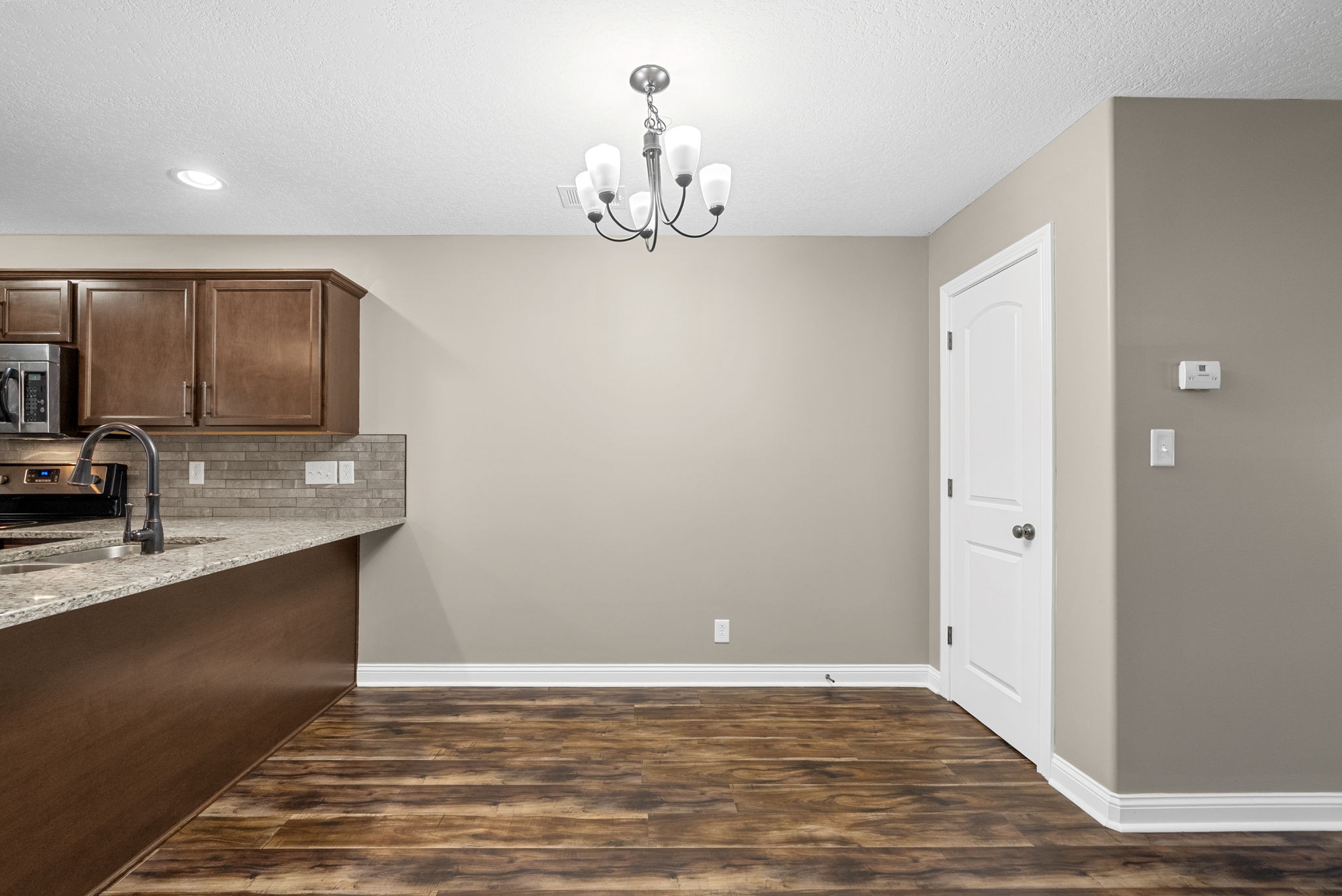 352 Sam Houston Circle Clarksville, TN 37040 - Photo 9 of 29 a view of kitchen with granite countertop cabinets and sink
