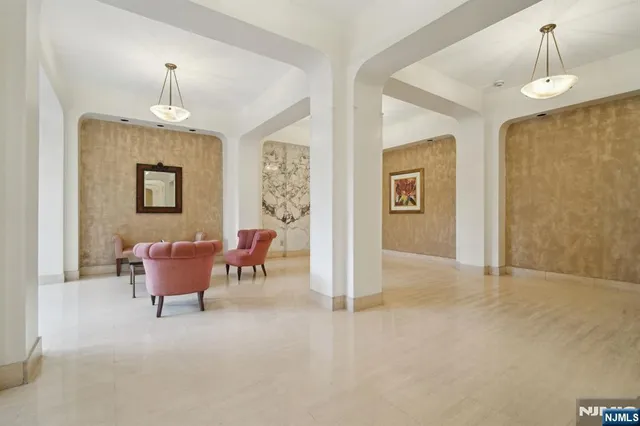 a view of an empty room and glass door