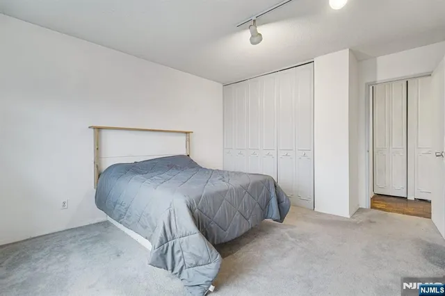 a bedroom with a bed and a cabinets