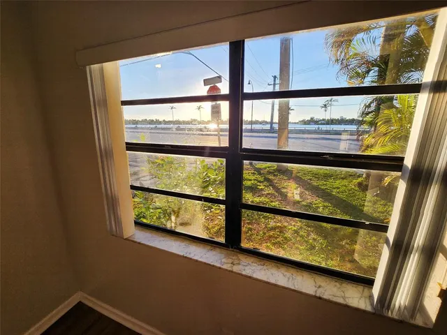 a view of a balcony with wooden floor