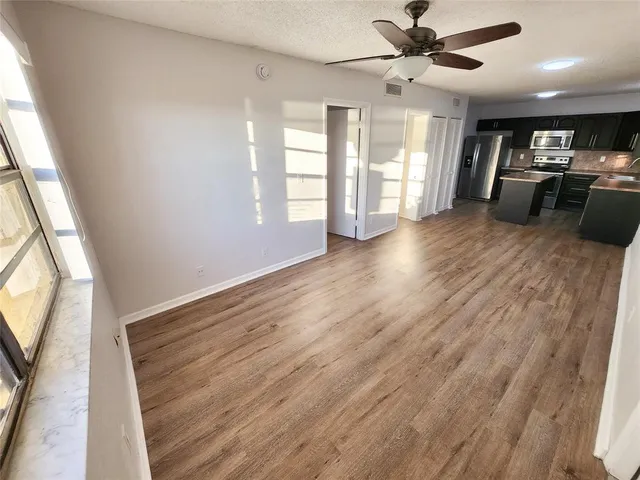 a view of an empty room with a window