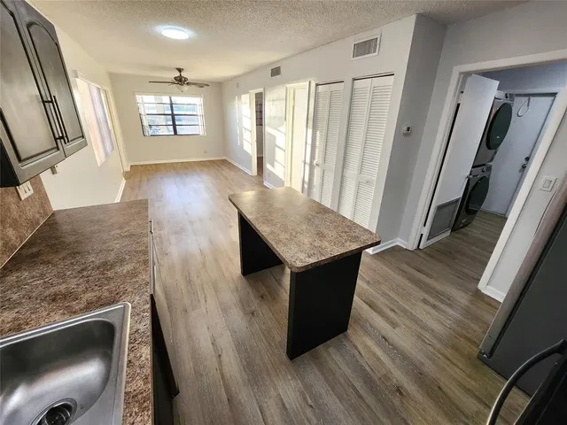 a room with wooden floor and front door