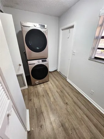 a view of a hallway with washer and dryer