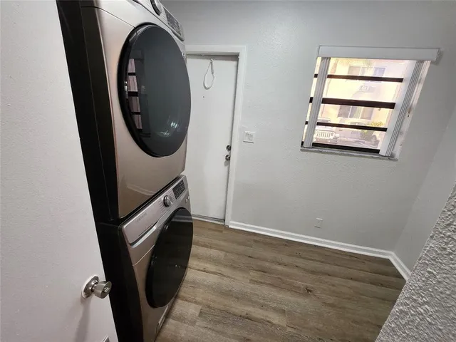 an entryway with a washer and dryer