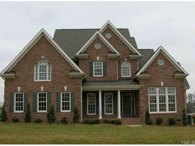 3313 Cotton Road Raleigh, NC 27601 - Photo 1 of 10 Beautiful all-brick custom home - covered front porch w/columns, sideload garage, and room to add a 2nd garage! Very nice level lot. Walk-up attic, too! Exterior Front