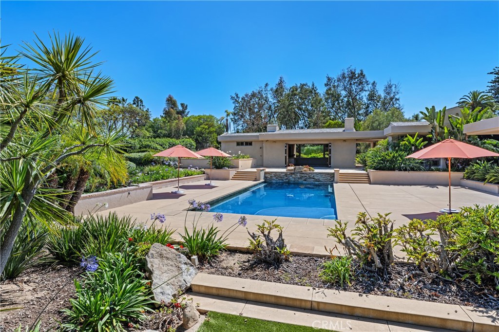 6533 Lago Lindo Rancho Santa Fe, CA 92067 - Photo 44 of 57 a view of a backyard with plants and patio