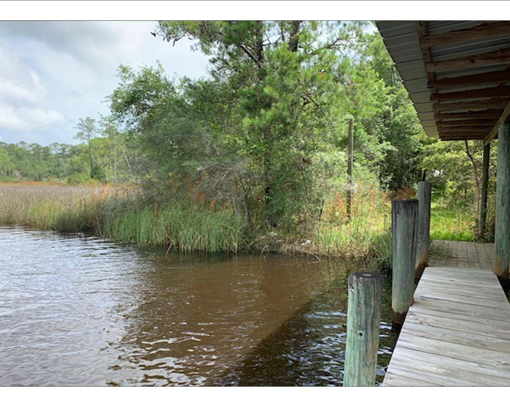 130 Lagrange Road Freeport, FL 32439 - Photo 6 of 17 a wooden pier with lake view