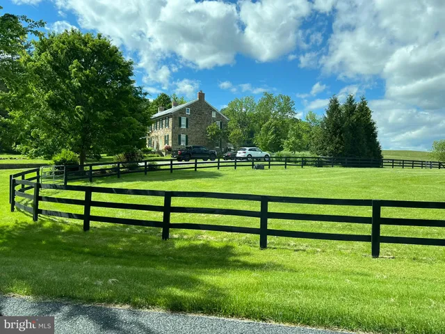 a view of a swimming pool with a yard