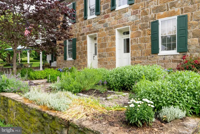 a bedroom with furniture and a wooden floor